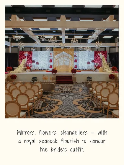 The varmala stage, decorated with mirrors, flowers, and chandeliers, featuring a royal peacock motif to honor the bride's outfit. This shows our dedication to personalizing decor.