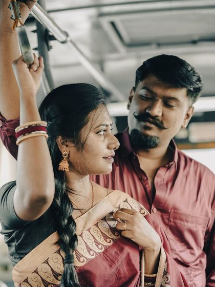 A cinematic shot of a couple on a bus, capturing a quiet, romantic moment reminiscent of classic Indian films.