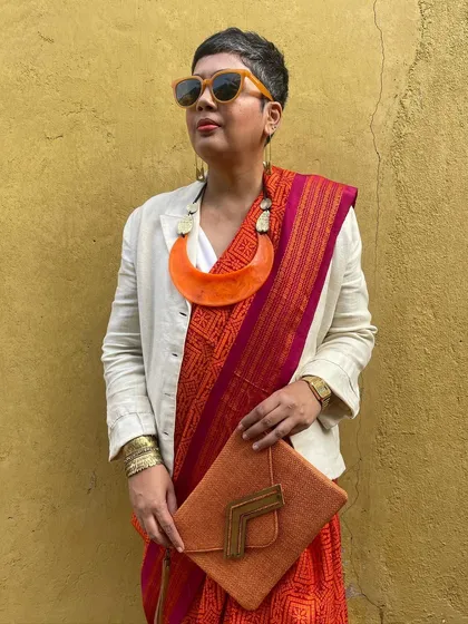 We believe in giving beautiful textiles a second life. This image showcases our overprinting service, where we take a pre-loved vintage Kanjeevaram silk saree from our founder's personal collection and refresh it with a vintage 'chunadi' block print.