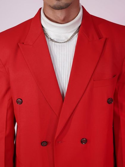 A close-up of our bold red suit jacket. It's the kind of statement piece that shows you're not afraid to stand out.