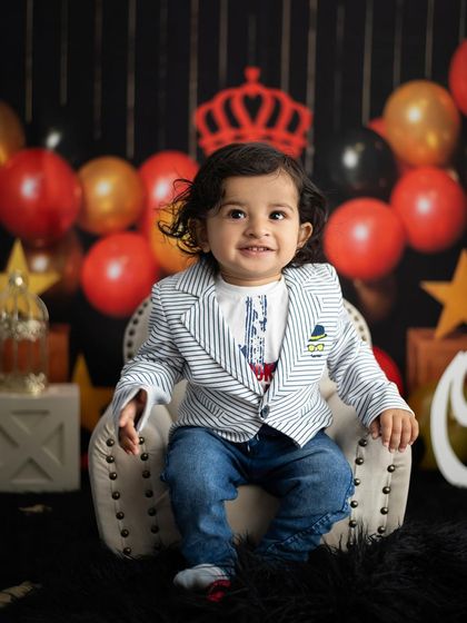 The little king sitting on his throne. We have miniature furniture perfectly sized for one-year-olds.