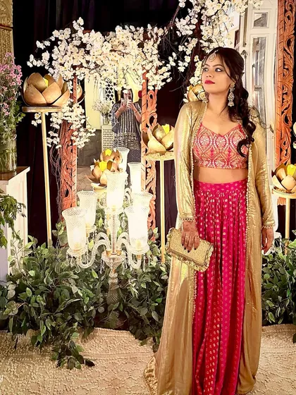 Ready for the celebration. For weddings and festive occasions, I help you curate looks that are elegant, memorable, and uniquely you. This indo-western outfit in pink and gold is perfect for making a statement with grace.