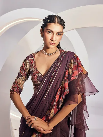 A close-up portrait in the DELILAH Saree Set, highlighting the sweetheart neckline and the rich, luscious hues of the printed fabric.