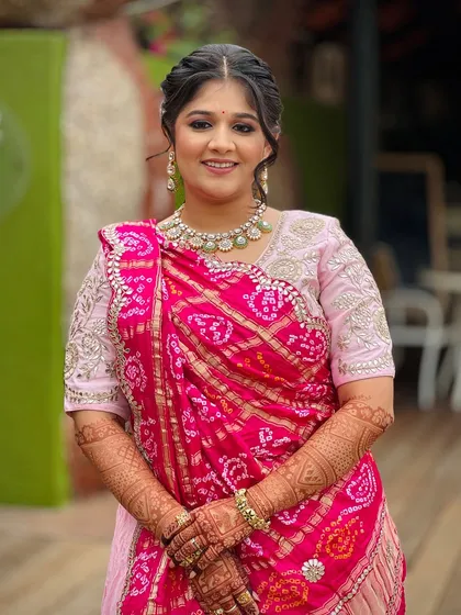 Another beautiful portrait, highlighting her smile and the elegance of her traditional attire.