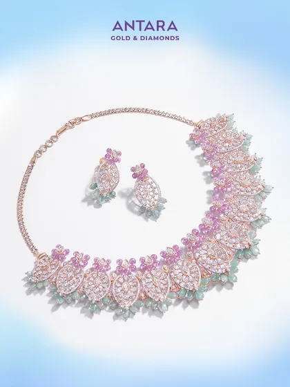 This diamond necklace set is a fusion of strength and elegance. I designed it for those who command a presence, with pavé-set diamonds creating a leaf-like pattern accented by pink and green gemstones.