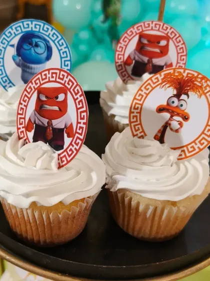 These "Inside Out" themed cupcakes feature all the different emotion characters from the movie. They are a fun and colorful choice for a Disney Pixar themed party.
