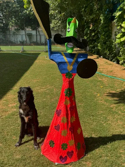 Shifu posing with a handmade Ravan effigy during our Dussehra celebrations.
