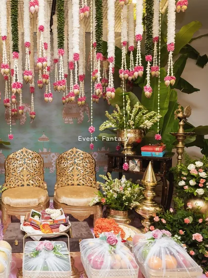 I believe magic lies in the details, especially during intimate pre-wedding rituals. This setup features traditional brass decor, fragrant flower garlands, and beautifully wrapped gifts, creating a serene and sacred space for the bride's family ceremonies.