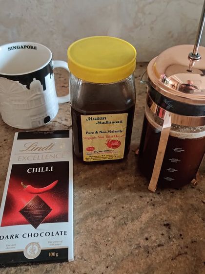 My pre workout ritual. Black coffee from a french press, a piece of dark chili chocolate for a kick, and some raw honey. Simple, effective fuel.