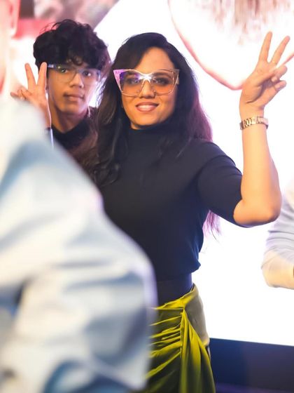 Peace signs from the crowd at the Aura NYE 2024 party.