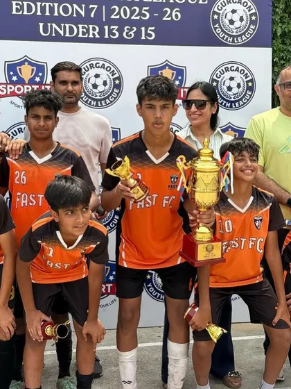 Our U13 player Rajveer Singh, awarded Best Striker in the Gurgaon Youth League, holding his individual award alongside the team trophy.