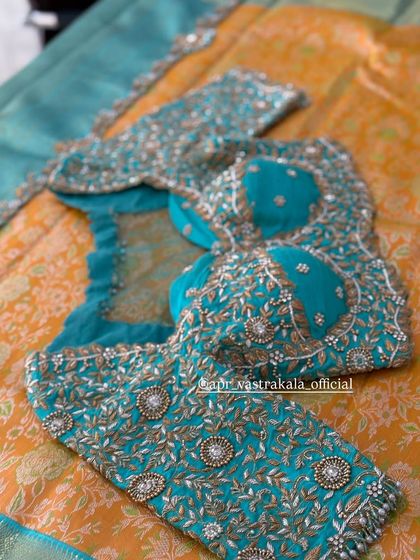 The full layout of the turquoise blouse.