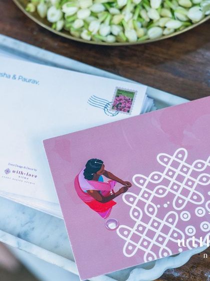Custom stationery for a summer wedding, featuring a kolam design. This traditional art form, symbolizing good luck, was a recurring motif throughout the event.