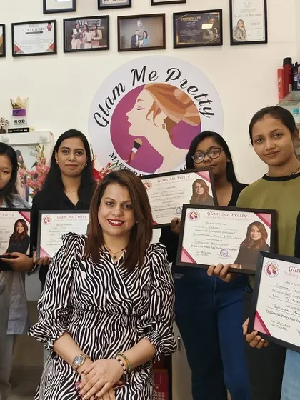 Another shot of my wonderful graduates, proudly holding their certificates. It's a joy to see them ready to start their careers.