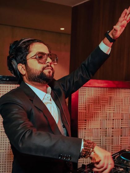 Throw your hands up and celebrate life. A dynamic action shot from a private wedding event.