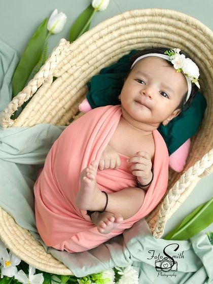 This little one looks so cozy in this basket, peeking out with a sweet expression. The combination of textures and soft colors is lovely.