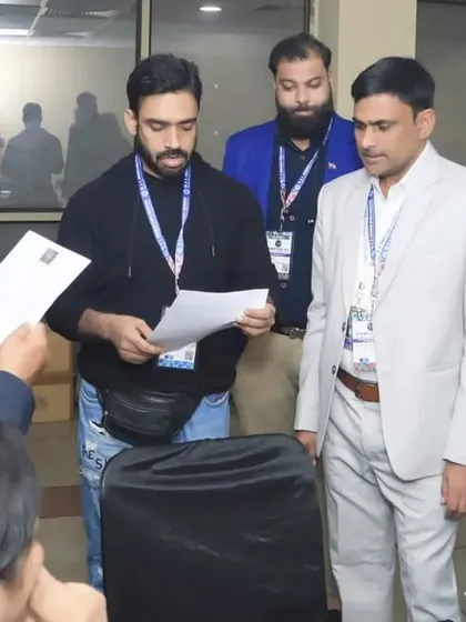 Behind the scenes at the registration desk. Our staff and officials work diligently to ensure a smooth and organized experience for all participating athletes and teams.