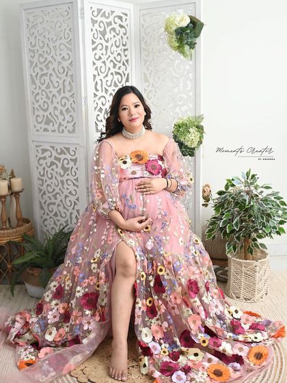 Blooming with life. This unique portrait features a beautiful gown adorned with colorful flowers, creating a vibrant and joyful image in my bright studio setup.