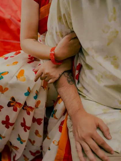 A detail shot focusing on the couple's hands and the bride's beautiful butterfly-print saree. I believe in capturing the small details that add to the overall story of the day.