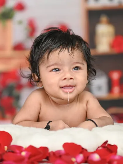 Capturing the 4-month milestone. At this age, they have great head control for tummy time photos, showing off their curious expressions.