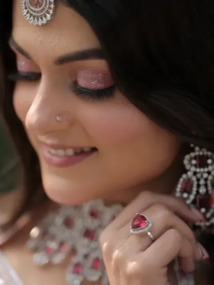 A stunning close-up of the bride, focusing on her flawless makeup and exquisite jewelry. This type of shot highlights the incredible work of the makeup artist and the beauty of the bridal details.