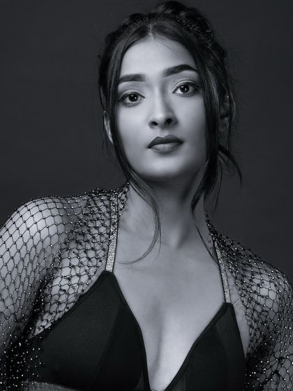 A serious and direct black and white portrait, a great addition to a model's portfolio.