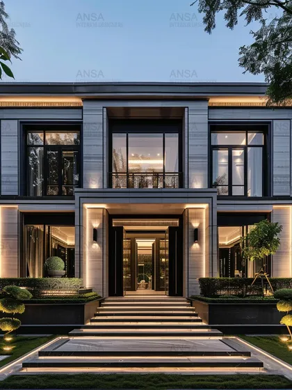 The entrance to a home sets the tone for everything inside. This grand entryway with its illuminated staircase and clean, modern lines creates an immediate impression of sophistication and style, welcoming you into a world of curated design.