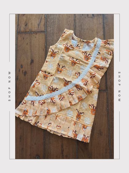 Embrace the charm of nature with our Small Deer Printed Dress. Adorned with pleat detailing and delicate white lace, it’s a cotton dream come true.