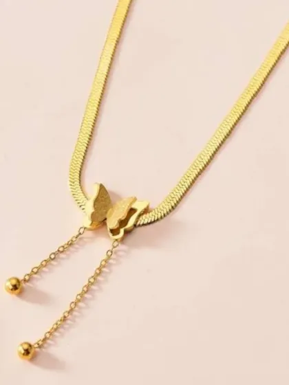 My butterfly lariat necklace, featuring a unique design where the chain threads through a butterfly charm, with another small butterfly at the end.