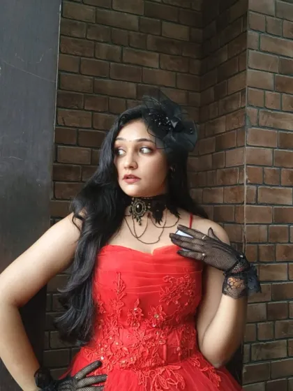 A close-up of the bodice on our red ball gown, showing the beautiful embroidery. This dress is perfect for pageants, parties, or pre-wedding shoots.