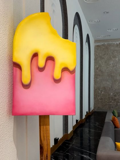 It's all in the details! We created custom props like this giant melting popsicle to make the Candyland baby shower theme feel truly immersive and fun.