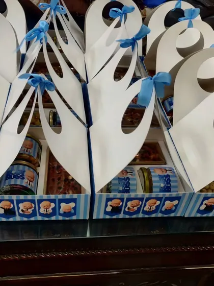 A different style of 'Boss Baby' return hamper, using a unique triangular box design. I can adapt themes to various packaging options to suit your preference and budget.