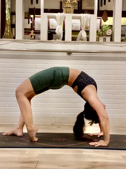 Urdhva Dhanurasana, or Wheel Pose, is a deep backbend that opens the entire front body. It teaches us that life, like a half-circle, has bends and challenges that we can meet with grace.