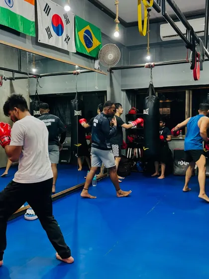 The energy in our group MMA and kickboxing classes is unmatched. Here you can see the team working on heavy bag drills, building power and stamina together. We push each other to be better every single day.