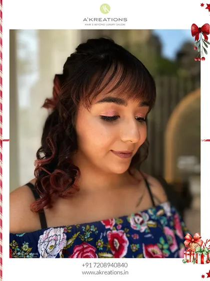 Another view of this festive hairstyle, showing the detail in the curls and how the bangs frame her face.