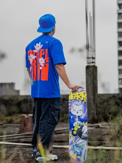 A shot from the Hearty Skateboards photoshoot, showing off the back of the t-shirt that was released alongside the custom deck.