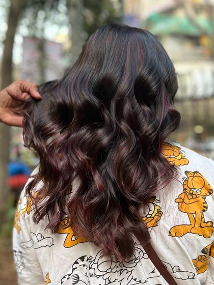 Our Cherry Choco balayage blend. This look combines deep chocolate tones with hints of cherry red for a subtle yet playful effect.