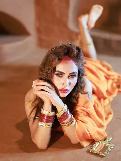 This is from a bold, conceptual shoot inspired by the song 'Hai Rama Yeh Kya Hua'. The pose and the rustic setting create a raw and evocative image.