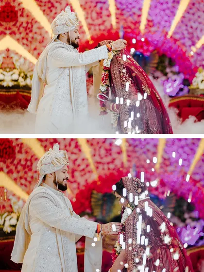 The varmala ceremony, captured with dramatic smoke and sparklers in the background.