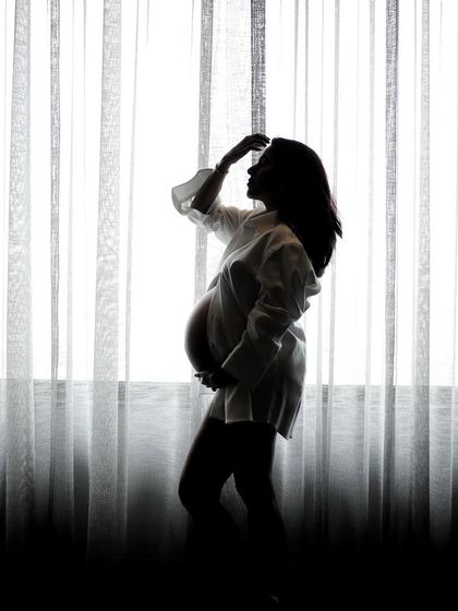 Another artistic silhouette from a premium maternity session. We use light and shadow to sculpt the body and create dramatic, fine-art portraits that celebrate the beauty of pregnancy.