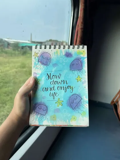 A travel sketch from a train ride, with cute jellyfish and the reminder to "slow down and enjoy life."