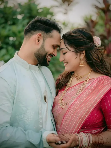 A happy and romantic moment between the couple, perfect for an engagement album.