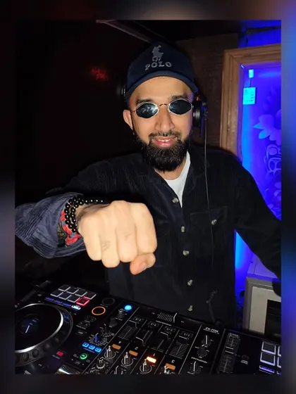 Getting ready to drop the next beat. My style is interactive, and I'm always connected to the energy of the room.