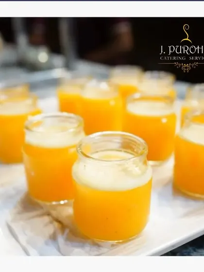 Nothing beats the taste of real fruit. My fresh juice station offers options like these vibrant orange juice shots, squeezed on-site to guarantee maximum freshness and flavor. They serve as a perfect, healthy welcome drink or a refreshing palate cleanser during any event.