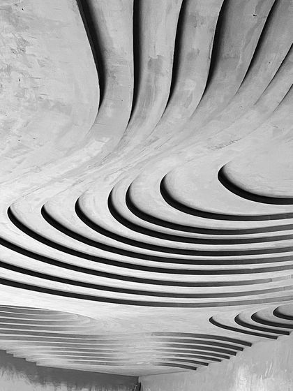 The play of shadow and light on these raw, sculpted forms is a design element in itself. We are obsessed with creating structures that have inherent beauty and drama, even before the final finishes are applied.