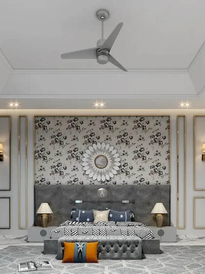 A bedroom design featuring a striking floral wallpaper as a feature wall behind the bed. The wall is framed with classical mouldings and flanked by elegant wall sconces, creating a balanced and artistic composition.