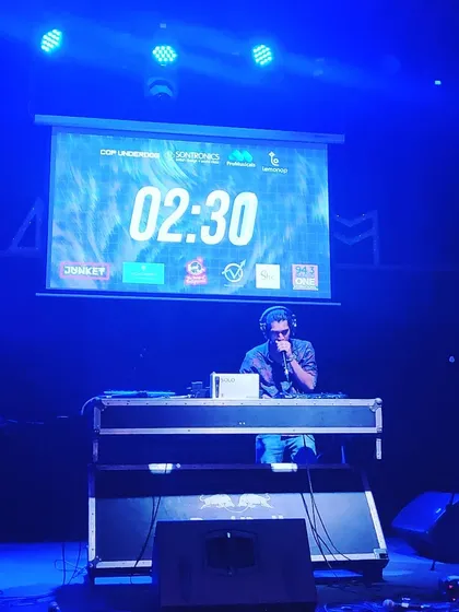 On stage during a live loop station battle. You can see the timer on the screen, adding to the pressure. This is where practice and creativity come together under the lights.
