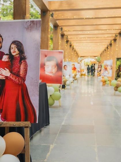 A gallery-style entrance for Ryne's woodland-themed party. I created a long walkway lined with large photo canvases, telling the story of the baby's first year for everyone to enjoy.