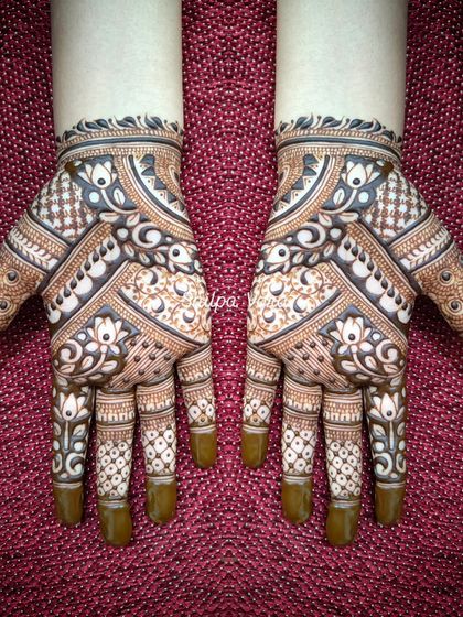 A beautiful symmetrical design with a mix of geometric and floral patterns, perfect for a festive look.