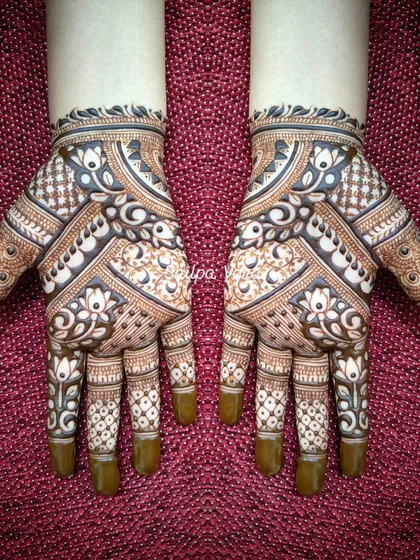 A beautiful symmetrical design with a mix of geometric and floral patterns, perfect for a festive look.